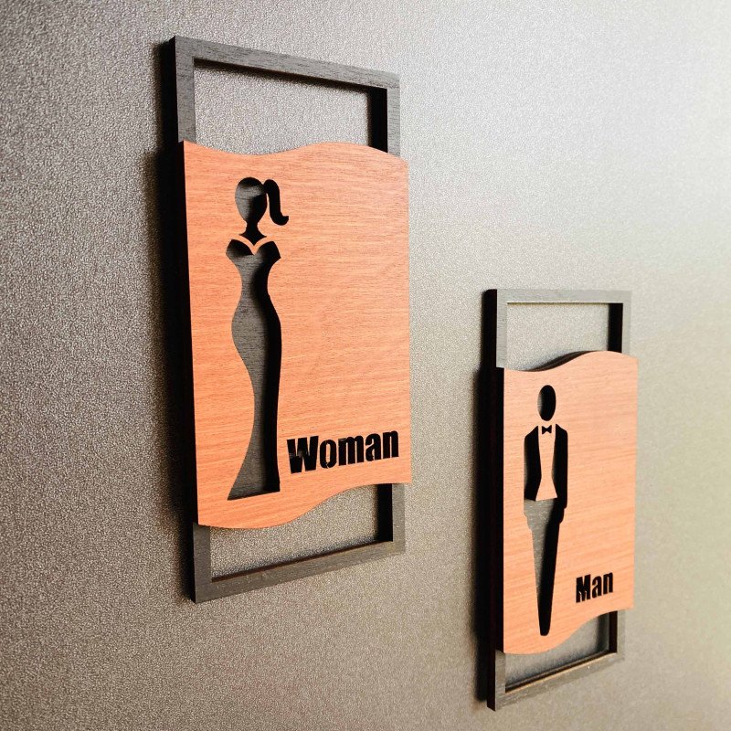 Дизайнерські таблички Man + Woman для туалету — чорна та горіхова фанера, 2 шт.