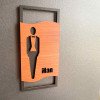 Дизайнерські таблички Man + Woman для туалету — чорна та горіхова фанера, 2 шт.